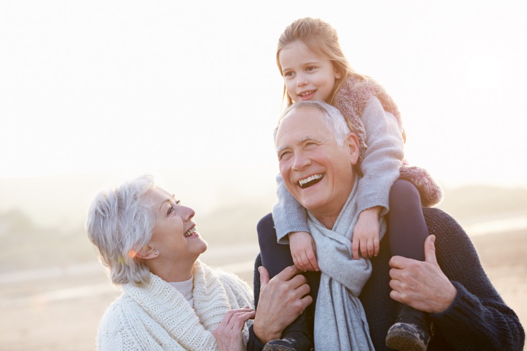 Grandparents with grandchild laughing