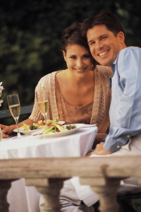 Dine out at a great restaurant in Currituck Couple at dinner posing for photo